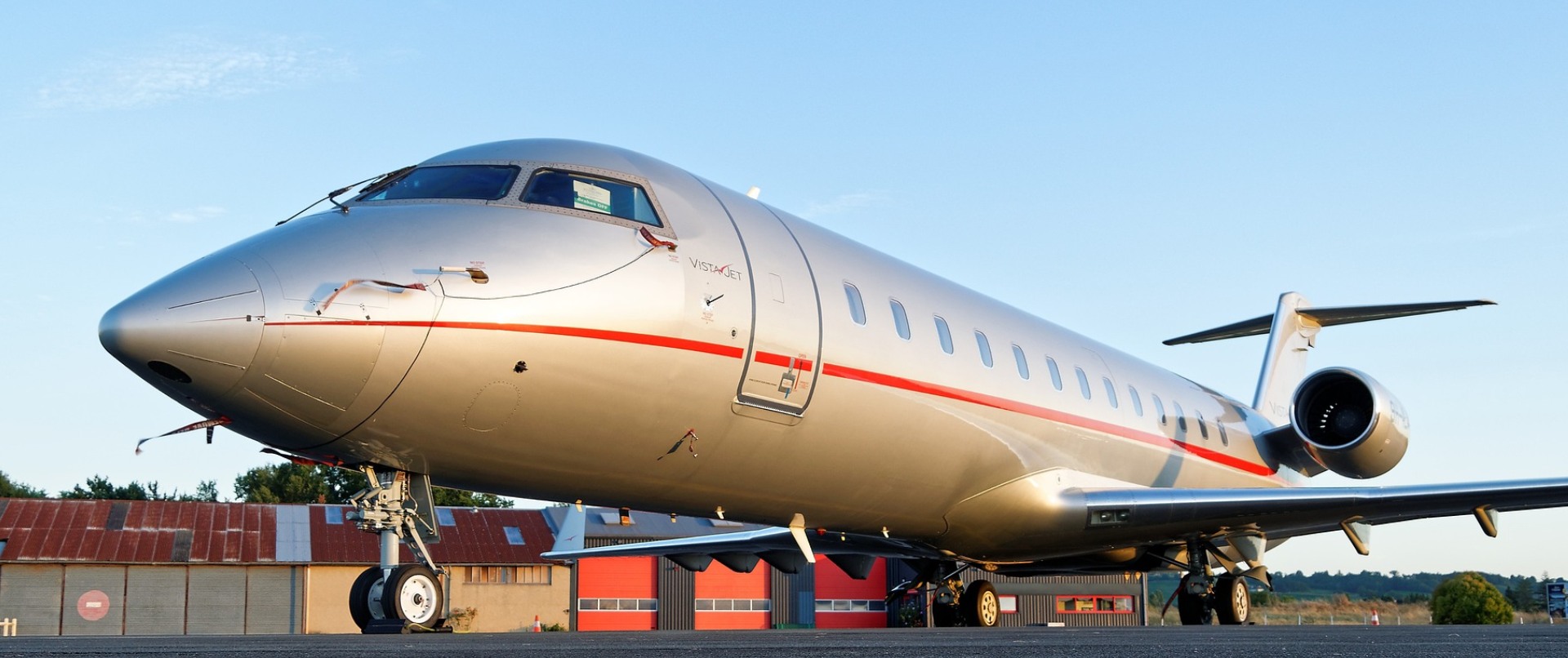 A large airplane sitting on top of an airport runway.