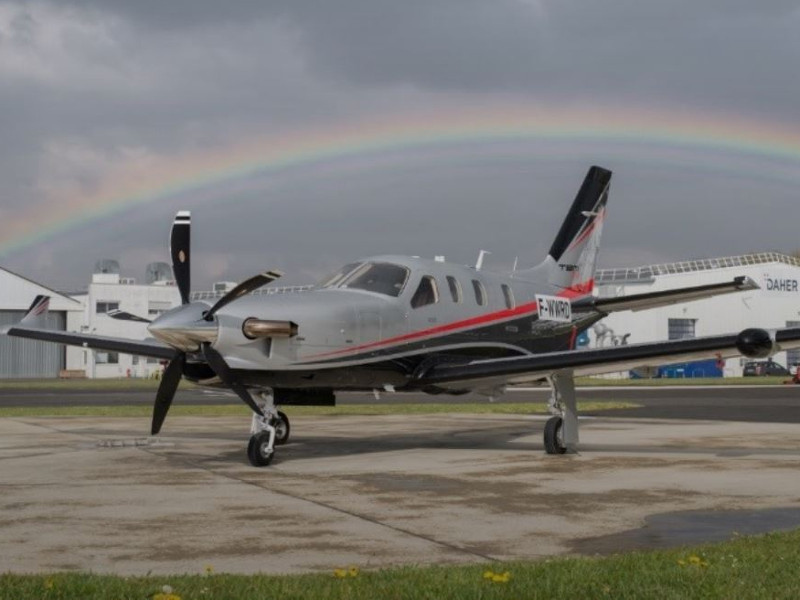 A small airplane sitting on top of an airport runway.