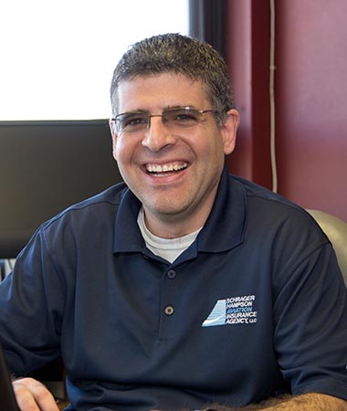 A man sitting in front of a computer.